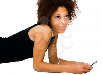 Close-up of a woman listening to music on a MP3 player isolated over white