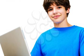 Portrait of a boy using a laptop and smiling isolated over white