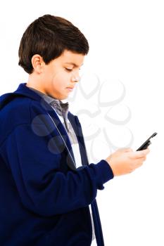 Close-up of a boy text messaging isolated over white