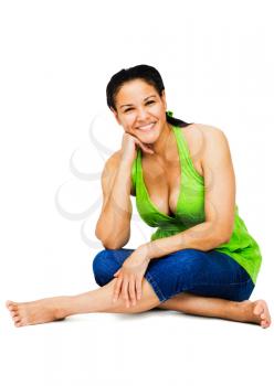 Young woman sitting and smiling isolated over white