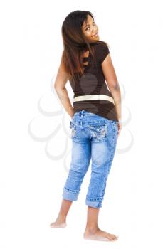 Pre adolescent girl posing and smiling isolated over white