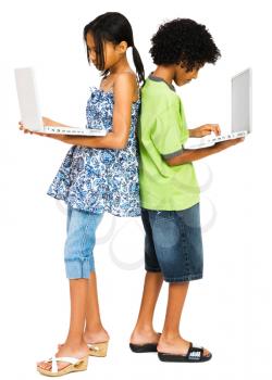 Two girls working on laptops isolated over white