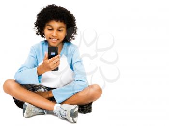 Boy looking at a mobile phone isolated over white