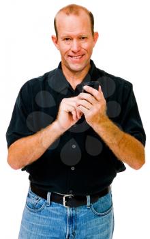 Portrait of a man text messaging on a mobile phone isolated over white