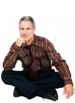 Sitting businessman smiling isolated over white