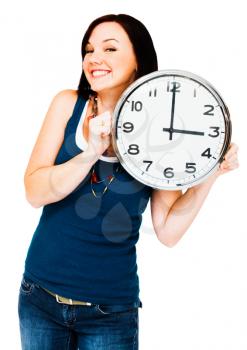 Caucasian woman holding a clock isolated over white