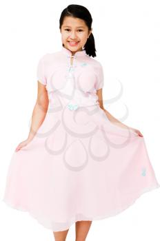 Close-up of a girl showing her dress and smiling isolated over white