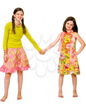 Caucasian girls holding their hands and smiling isolated over white