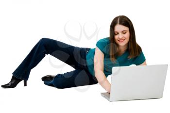Confident woman using a laptop isolated over white