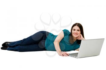Young woman using a laptop and smiling isolated over white