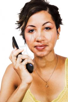 Smiling woman holding a mobile phone isolated over white