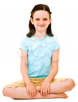 Caucasian girl sitting and smiling isolated over white