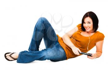Woman listening to music on an media player isolated over white