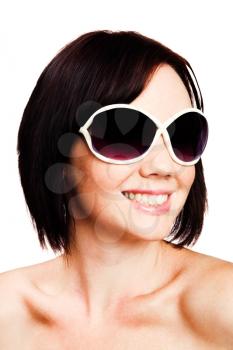 Young woman wearing sunglasses isolated over white