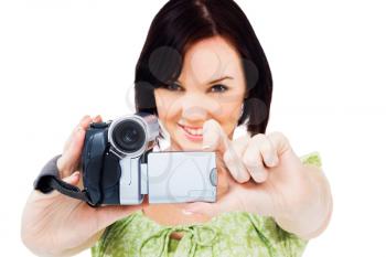 Close-up of a woman holding a home video camera isolated over white