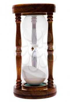 Close-up of an old hourglass isolated over white