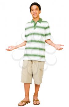 Teenage boy shrugging isolated over white