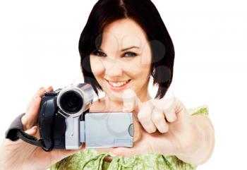 Portrait of a woman holding a home video camera isolated over white