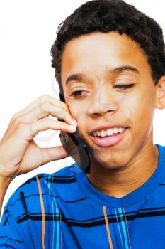 Teenage boy talking on a mobile phone isolated over white
