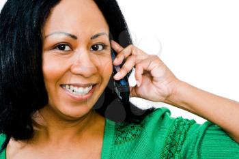 Confident woman talking on a mobile phone isolated over white