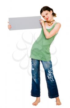 Smiling girl showing a placard isolated over white