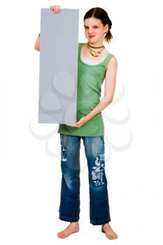 Girl showing a placard and smiling isolated over white