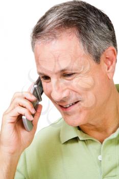 Happy man talking on a mobile phone isolated over white