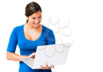 Smiling woman working on a laptop isolated over white