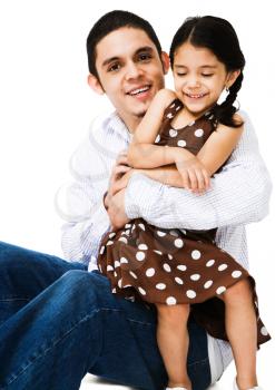 Man hugging a girl and smiling isolated over white
