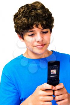 Happy boy text messaging on a mobile phone isolated over white
