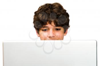 Caucasian boy using a laptop isolated over white