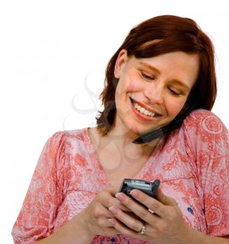 Happy woman using mobile phones isolated over white