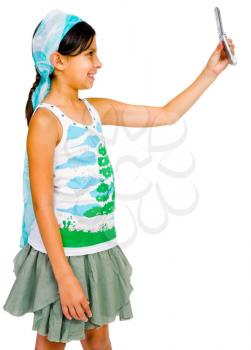 Child photo messaging on a mobile phone and smiling isolated over white