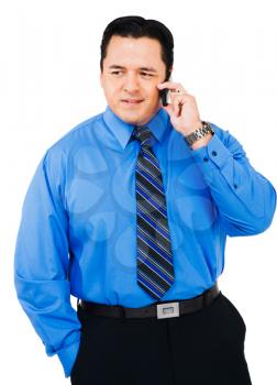 Businessman talking on a mobile phone isolated over white
