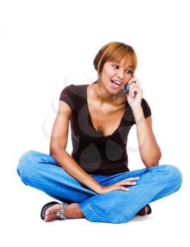 African woman talking on a mobile phone isolated over white