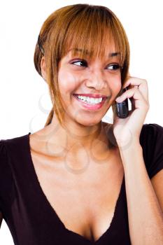 Smiling woman talking on a mobile phone isolated over white
