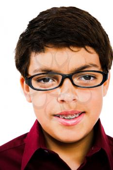 Boy wearing eyeglasses isolated over white