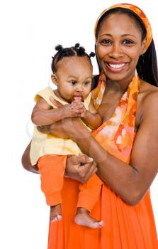 Woman carrying her daughter and smiling isolated over white