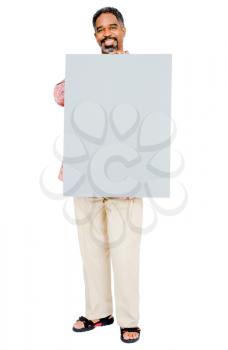 Happy mature man showing a placard isolated over white