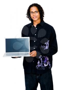 Man showing a laptop and smiling isolated over white