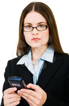 Young businesswoman text messaging on a mobile phone isolated over white