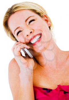Beautiful woman talking on a mobile phone isolated over white