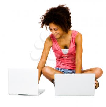 Smiling young woman using laptops isolated over white
