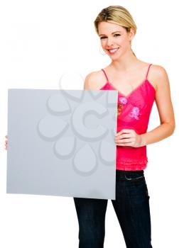 Woman holding a placard and posing isolated over white