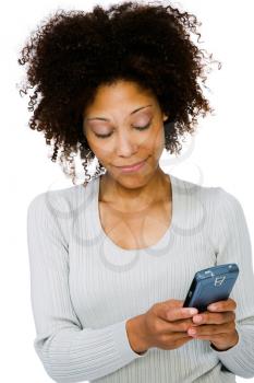 Close-up of a woman using a PDA and smiling isolated over white
