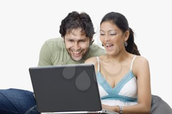 Couple chatting on a laptop