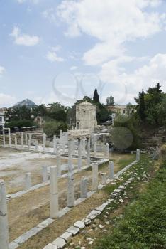 Columns in the courtyard with tower in the background, Tower of The Winds, Roman Agora, Athens, Greece