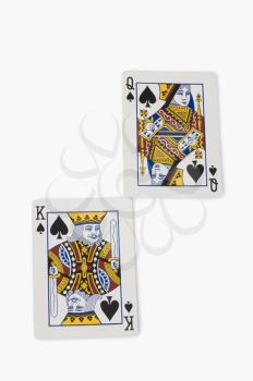Close-up of king of spades and queen of spades playing cards