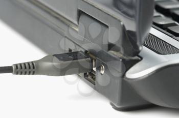 USB cable connected on USB port of a laptop