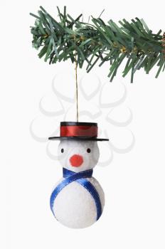 Snowman hanging on a Christmas tree